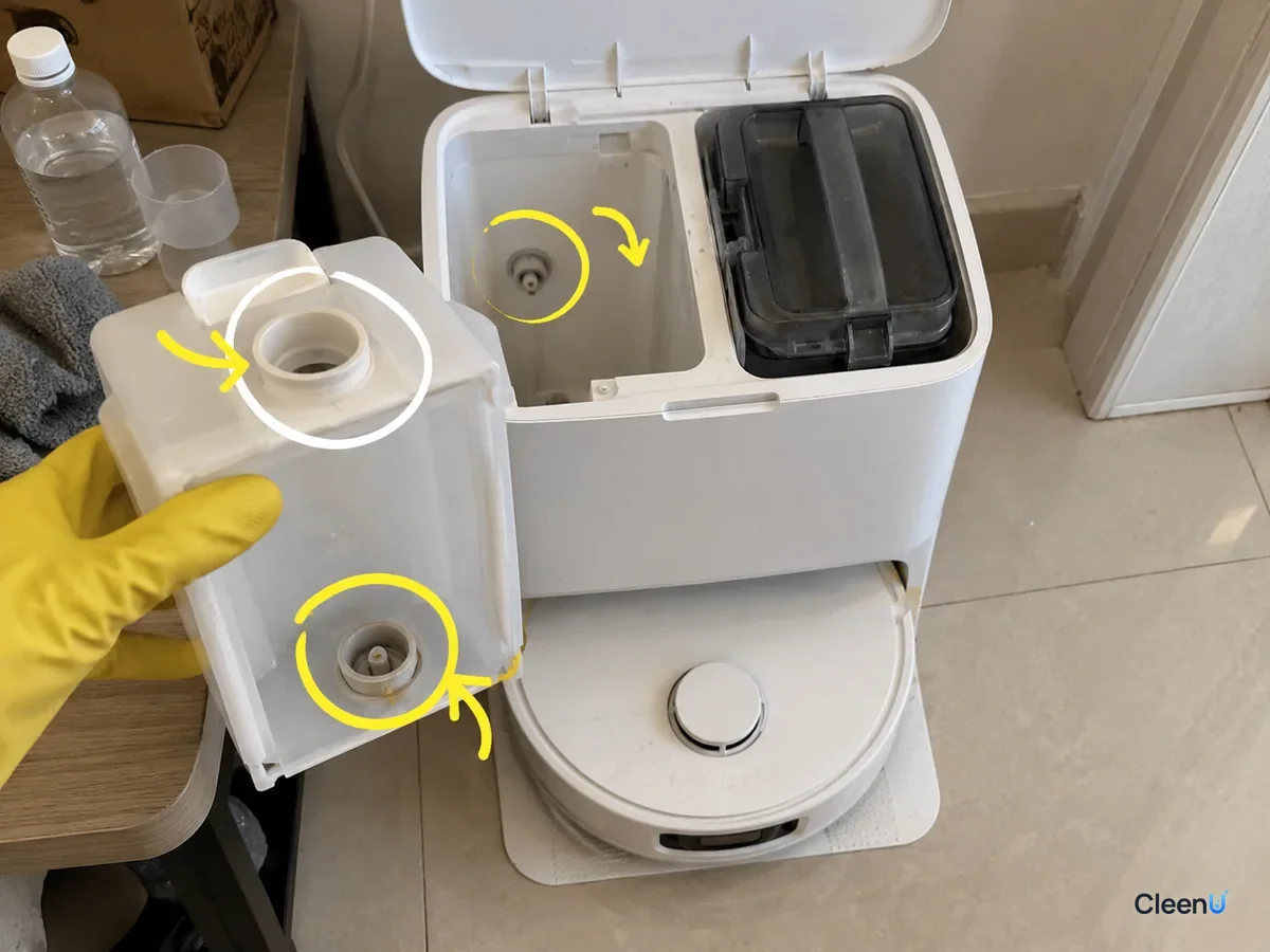 A dock's auto-dosing cartridge with its fill opening and outlet valve marked, plus the matching port inside the open dock.