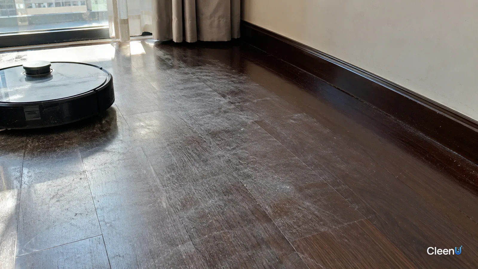 AI illustration: Dark wood flooring in window light, with gray-white hazy streaks across the center