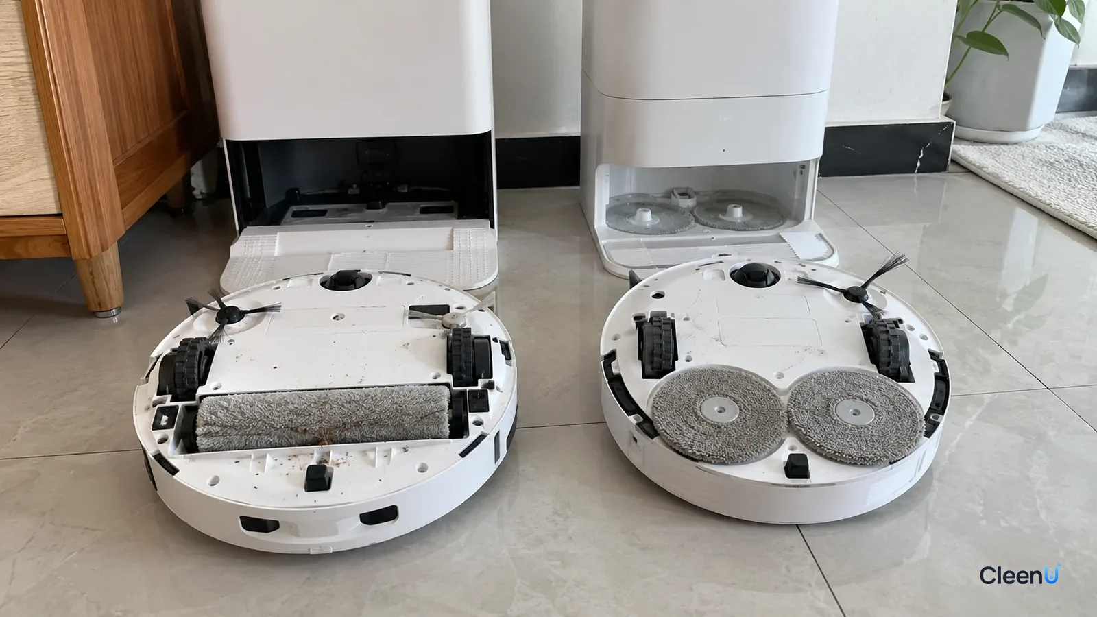 AI illustration: Two upside-down robot mops, one with a roller underneath and the other with round mop pads